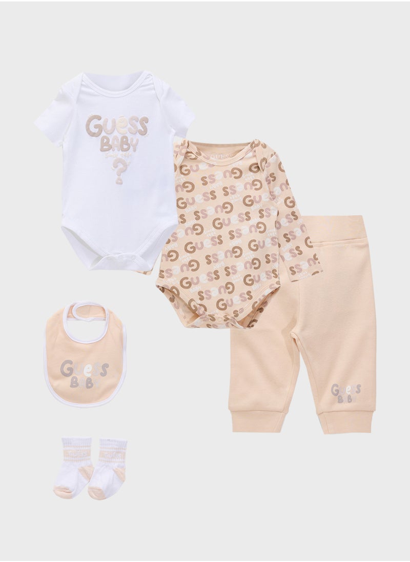 GUESS Kids  2 Pack Bodysuit, Bib, Socks & Pants Gift Set  - Image 1
