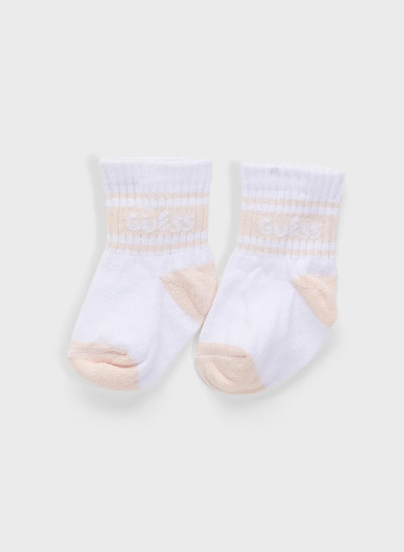 GUESS Kids  2 Pack Bodysuit, Bib, Socks & Pants Gift Set