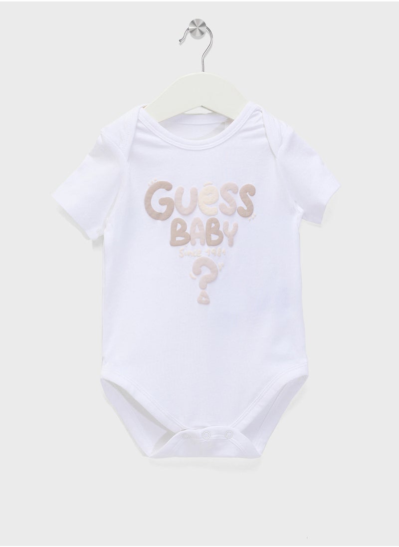 GUESS Kids  2 Pack Bodysuit, Bib, Socks & Pants Gift Set  - Image 2
