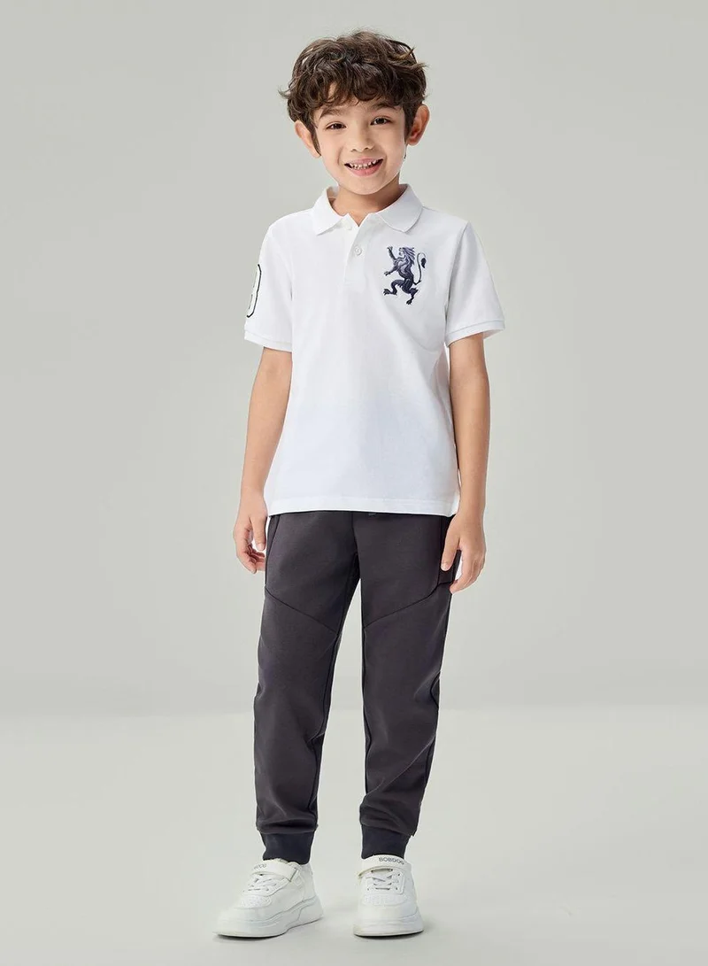 جيوردانو قميص بولو قطني مطرز بشعار الأسد، بقصة ضيقة للأطفال