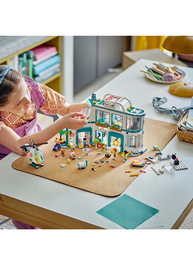 LEGO 42621 Friends Heartlake City Hospital Playset, Toy Helicopter And Mini-Doll Characters, Building Set For Kids, Medical Play, Gift For Girls And Boys Aged 7 Years Old And Over (1,045 Pieces)  - Image 4