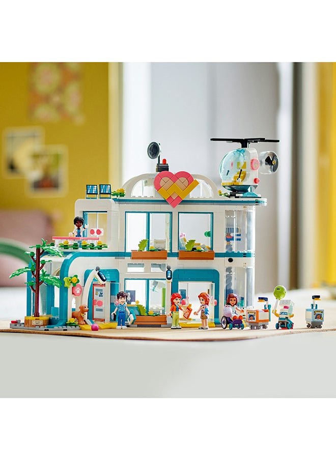 LEGO 42621 Friends Heartlake City Hospital Playset, Toy Helicopter And Mini-Doll Characters, Building Set For Kids, Medical Play, Gift For Girls And Boys Aged 7 Years Old And Over (1,045 Pieces)  - Image 5