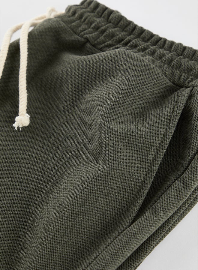 trendyol Khaki Plus Size Regular Cut Textured Sweatpants TMNAW25AJ00010  - Image 4