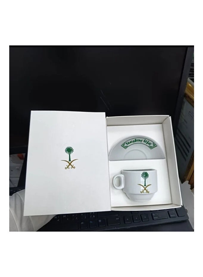 Mini Turkish coffee cups and saucers with the National Day logo printed on them.