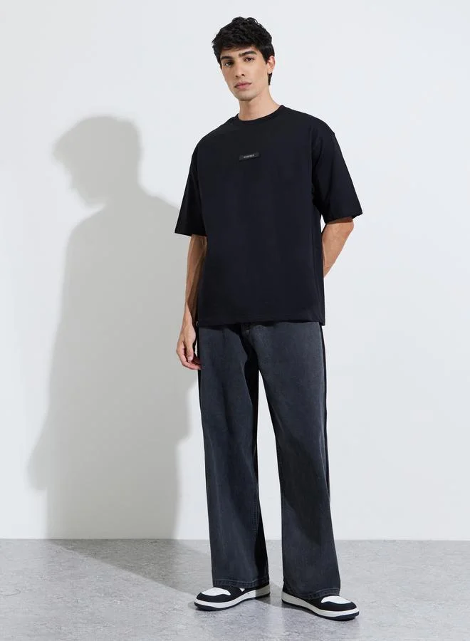 Styli  Black Silicon Print Crew Neck Short Sleeves Oversized T-Shirt for Men | Best Price UAE