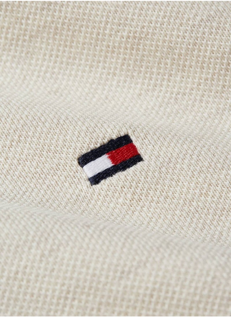 تومي هيلفيغر - تيشيرت بولو من قطن بيكيه عضوي مطاطي بقصة ضيقة من مجموعة 1985 للرجال، بيج - Image 1