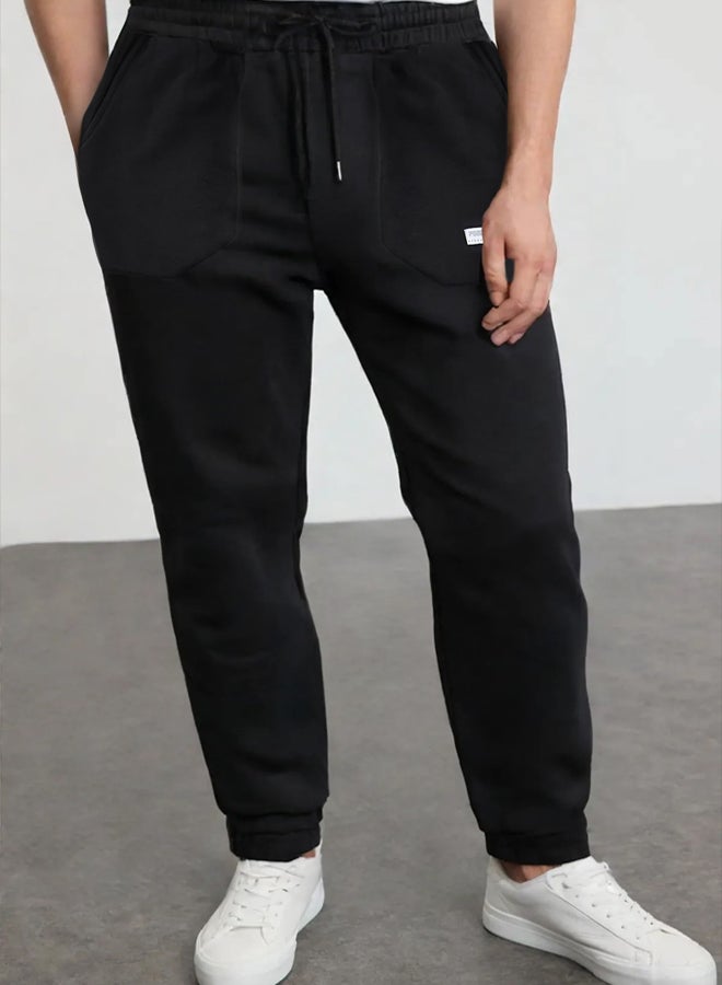 trendyol Black Regular Fit Label Appliqued Pocket Stitched Sweatpants TMNSS23EA00010 - Image 1