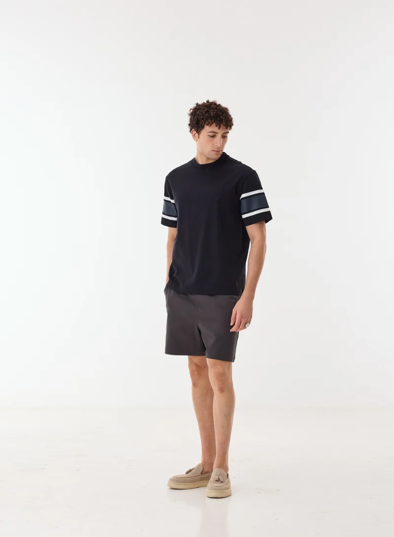 Ashita Fernandes Nadir Men’s Black Relaxed Fit T-Shirt – 100% Cotton Round Neck Tee with Sleeve Stripes | Lightweight Waist Length Slip-On Casual T-Shirt