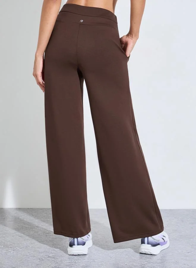 Styli Active  Brown Solid Pintuck Details Straight Leg Activewear Pants for Women | Best Price UAE