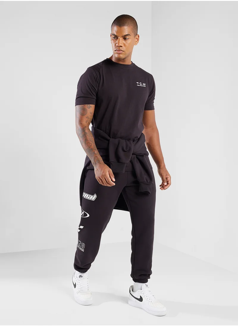 ذا جيفينج موفمنت Relaxed Fitted Racing Printed Sweatpants