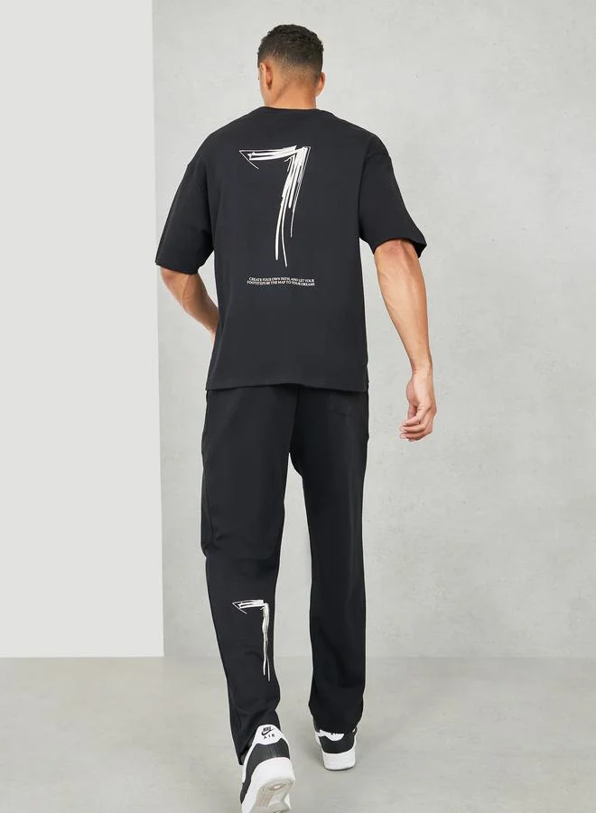 Styli Oversized Varsity Back Print T-shirt and Open Hem Relaxed Jogger Interlock Co-ords Set