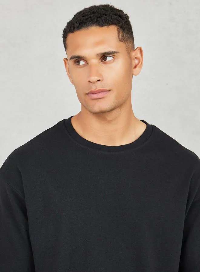 Styli Oversized Varsity Back Print T-shirt and Open Hem Relaxed Jogger Interlock Co-ords Set