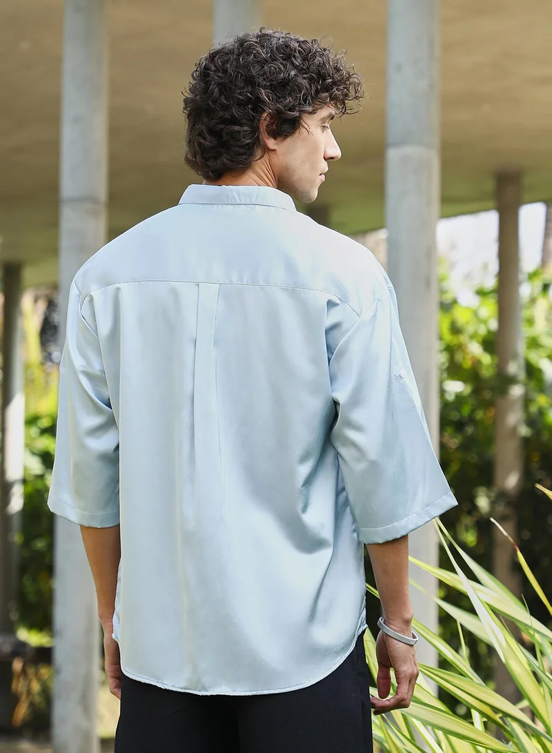 Campus Sutra Campus Sutra Men's Powder Blue Satin-Utility Oversized Shirt For Casual Wear | Spread Collar | Short Regular Sleeves | Button Closure | Oversized Shirt Crafted With Comfort Fit For Everyday Wear