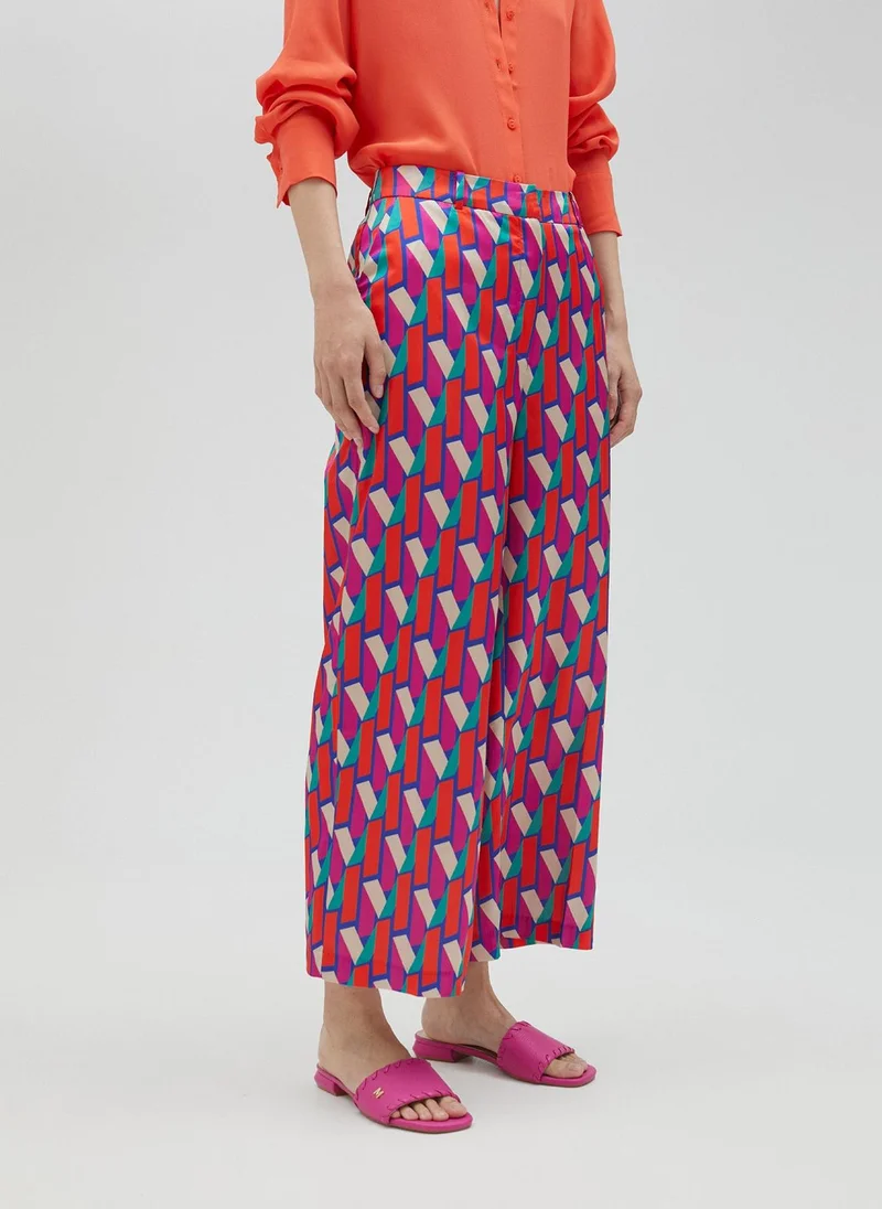 Lola Casademunt Palazzo trousers in multicoloured logo print
