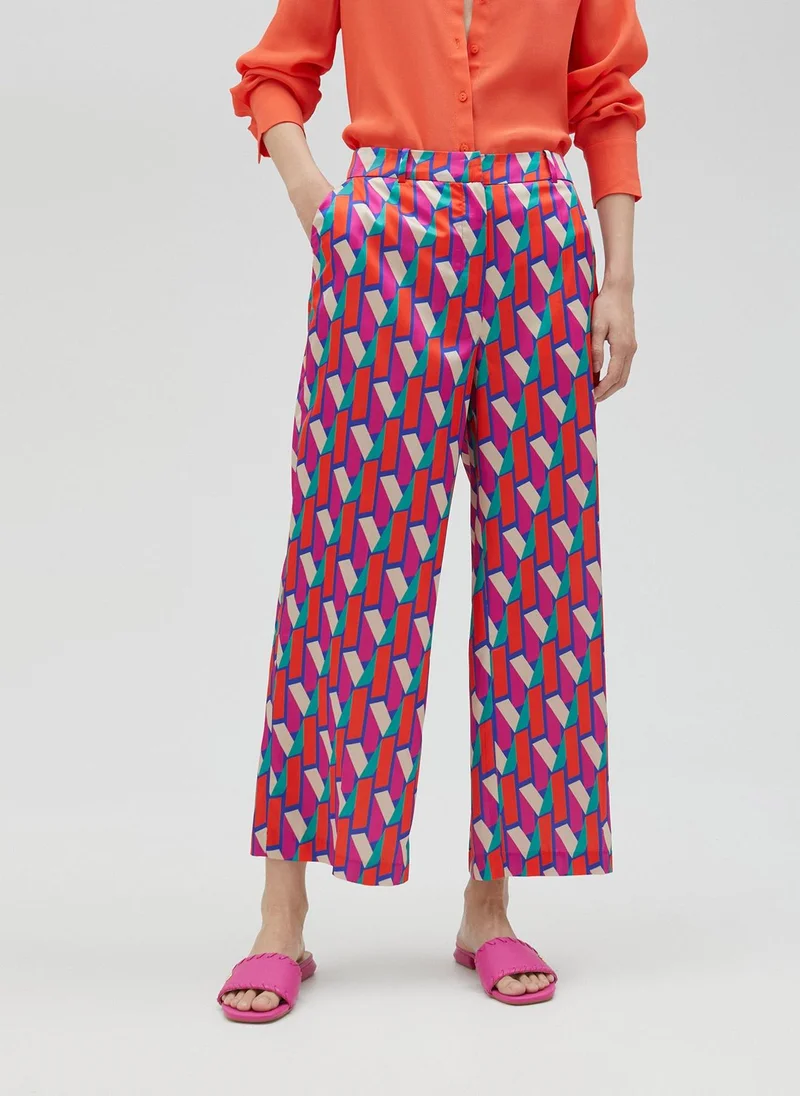Lola Casademunt Palazzo trousers in multicoloured logo print