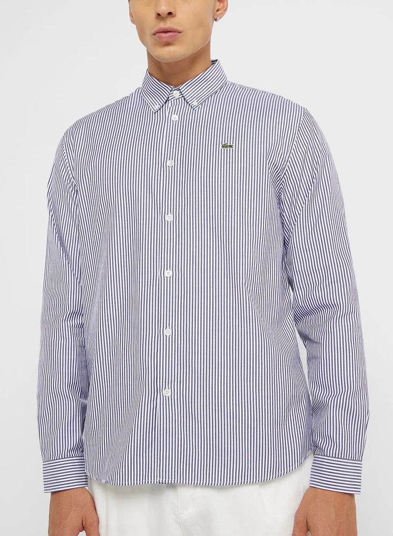 لاكوست قميص بطبعات خطوط