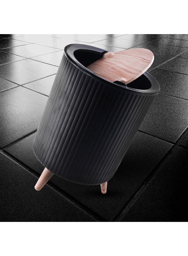 A multi-purpose waste basket designed for use in various spaces such as the kitchen, bathroom, office, bedroom, and hotels. Featuring an eye-catching design and a tasteful appearance that complements any environment, it also enhances your existing décor. Specially crafted to fit into narrow spaces, it comes with legs and a movable cover in wood-like colors. The practical and easy-to-use cover snaps shut immediately, providing an elegant look for your space and a perfect touch for your modern home.  - Image 1