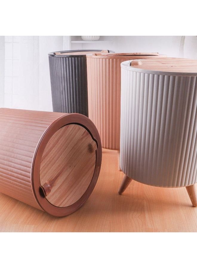 A multi-purpose waste basket designed for use in various spaces such as the kitchen, bathroom, office, bedroom, and hotels. Featuring an eye-catching design and a tasteful appearance that complements any environment, it also enhances your existing décor. Specially crafted to fit into narrow spaces, it comes with legs and a movable cover in wood-like colors. The practical and easy-to-use cover snaps shut immediately, providing an elegant look for your space and a perfect touch for your modern home.  - Image 3