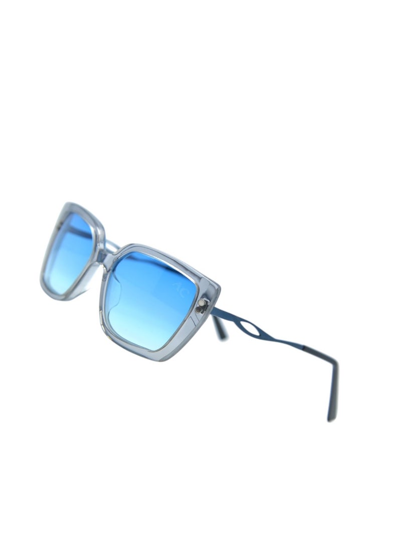 Armando Cavelli - Authentic Armando Cavelli sunglasses, crafted from carefully selected premium acetate for a luxurious look and longevity with extensive use. This model combines modernity and classic style, with a raw light grey transparent acetate front and mat blue -plated metal temples to complete your luxury look. Comes with premium polymer lenses offer UV400 protection in a gradient sky blue. - Image 1