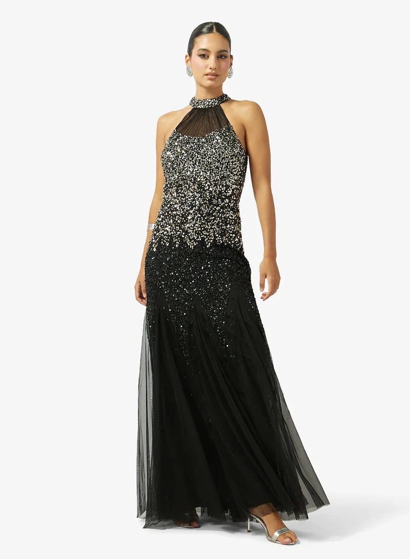 نمشي x فستان بياقة هالتر مزين