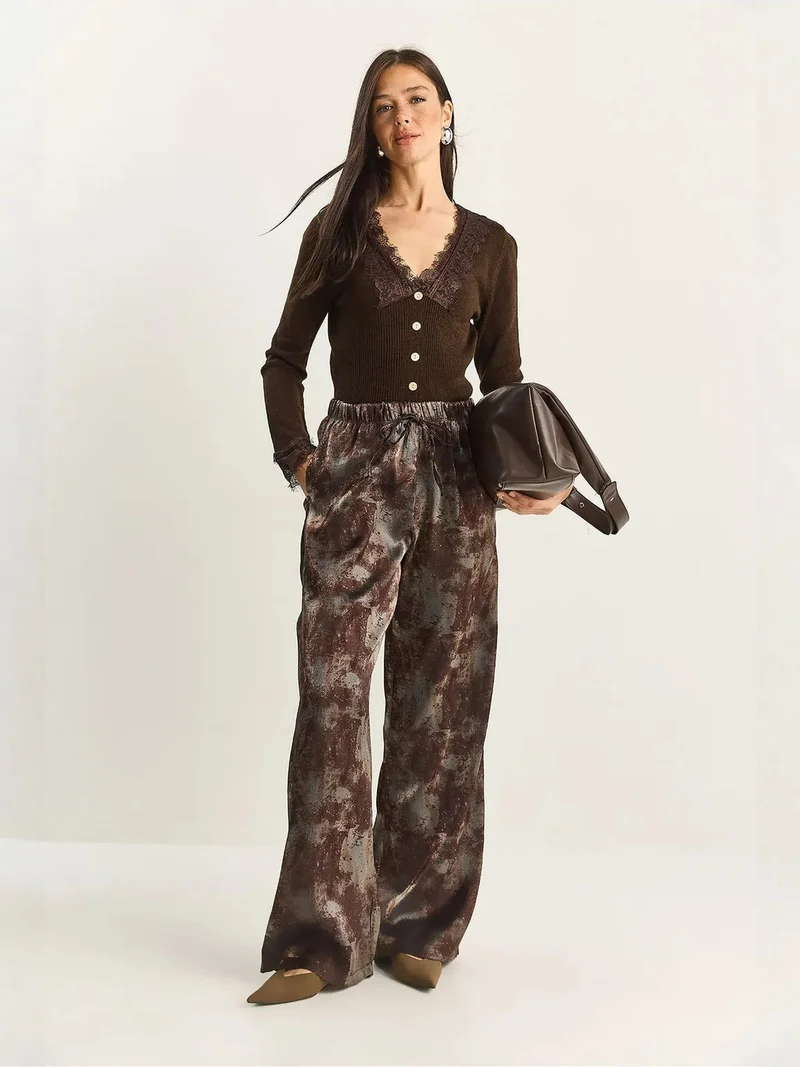 بيانكو لوتشي LUCCI High Waist Wide Leg Patterned Pants with Binding Detail