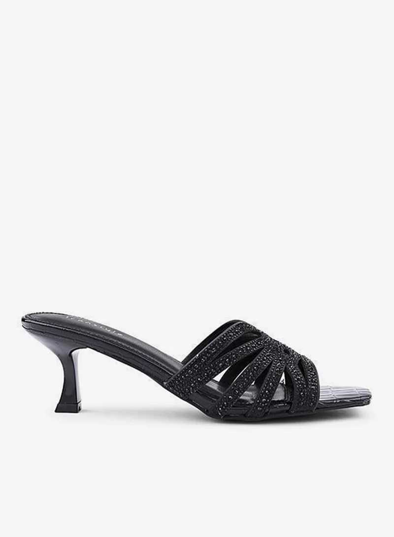 أيقون صنادل بكعب مزينة بأشرطة