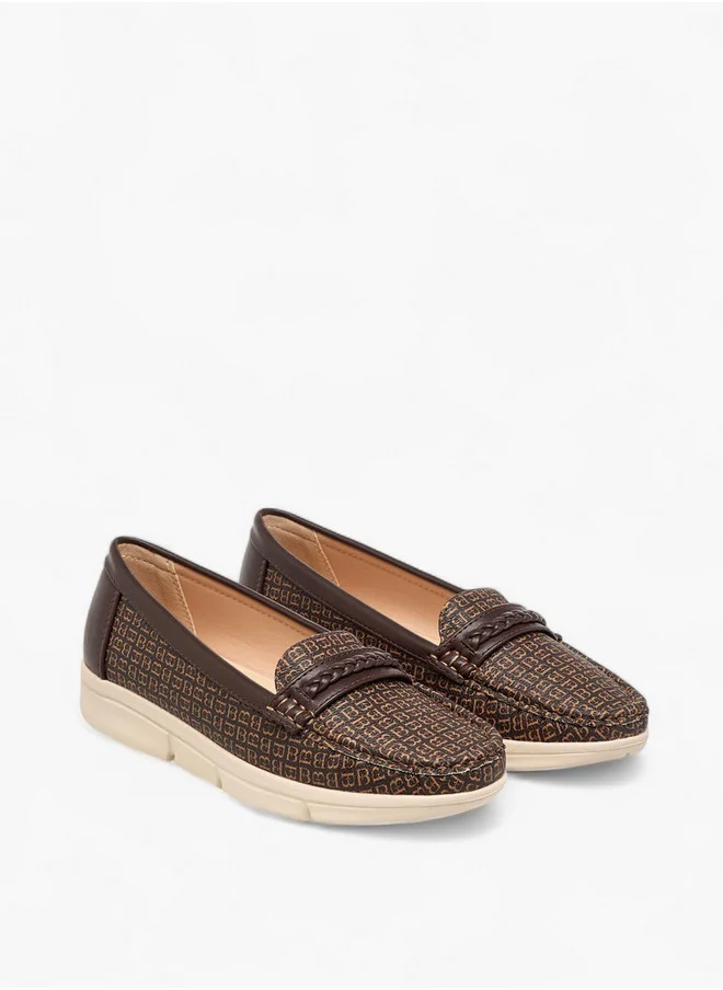 فلورا بيلا من شو إكسبرس Women's Monogram Print Slip-On Loafers with Braid Detail