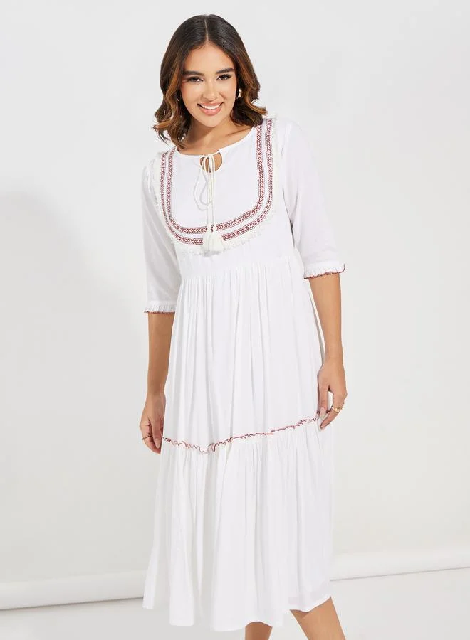 ستايلي Embroidered Panel Tie-Up Neck Midi Dress
