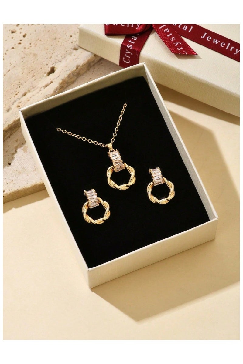 Women's accessory set in an elegant box consisting of a necklace and earrings made of rust-resistant zinc alloy, plated in gold, studded with cubic zirconia stones, with an elegant and modern design suitable for celebrations and holidays. - Image 1