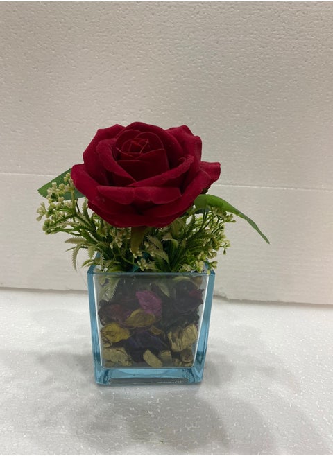 glass vase with a single red rose