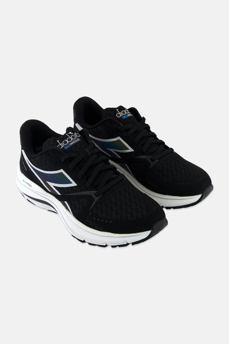 DIADORA أحذية تدريب نسائية واسعة ميثوس بلاشيلد 8 فورتيس، سوداء - Image 1