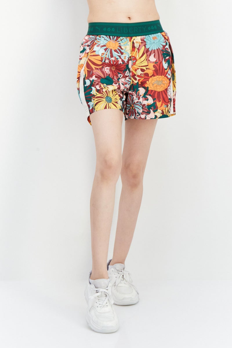 PUMA Women Sportswear Fit Floral Pattern Training Shorts, Green - Image 1