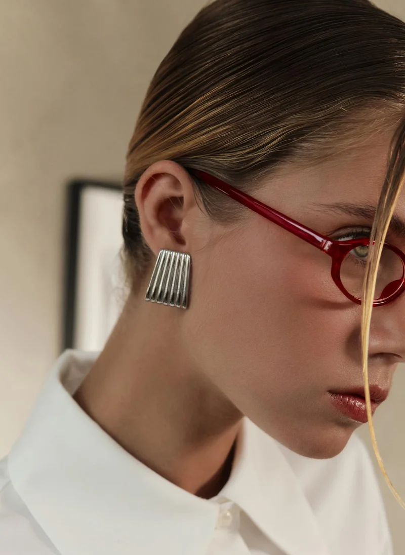 Trapezoidal stud earrings in textured metal