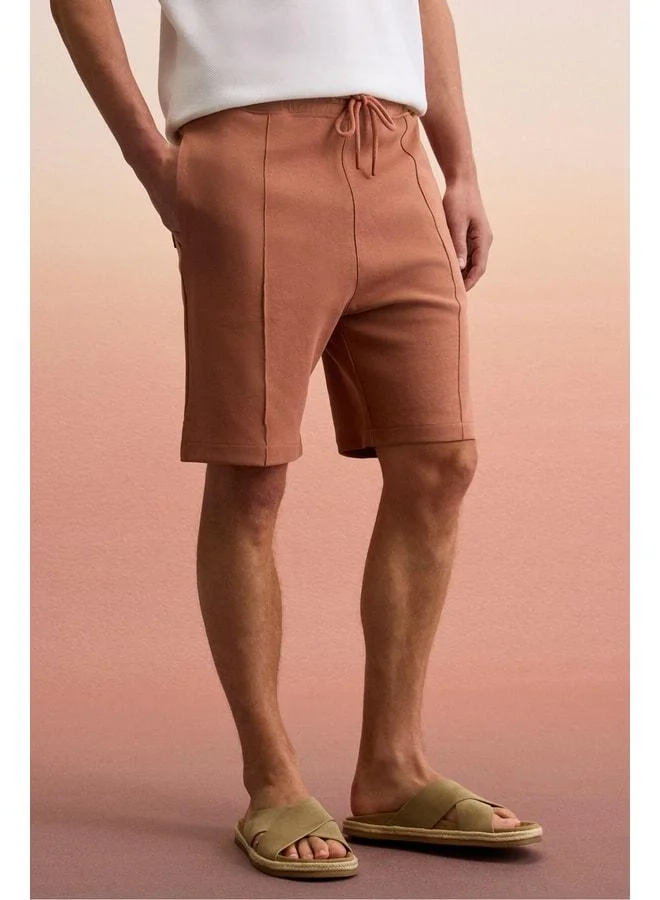 GRIMELANGE MATSEN Men's Waistband Elastic Side and Back Pocket Relaxed Tile-Color Shorts.