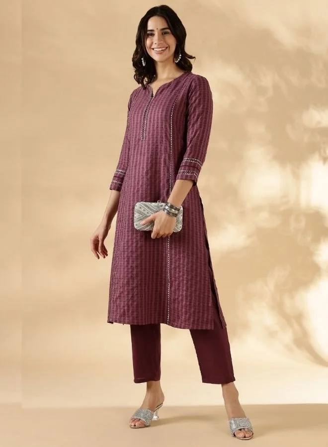Abhishti Textured kurta with delicate lace detail on the neck, shoulder princess and sleeves with solid pant