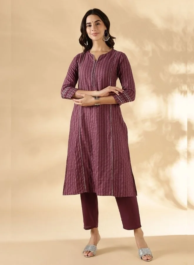 Abhishti Textured kurta with delicate lace detail on the neck, shoulder princess and sleeves with solid pant