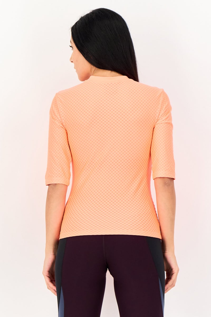 Nike بلوزة تدريب ضيقة للنساء بأكمام 3/4، برتقالي - Image 3