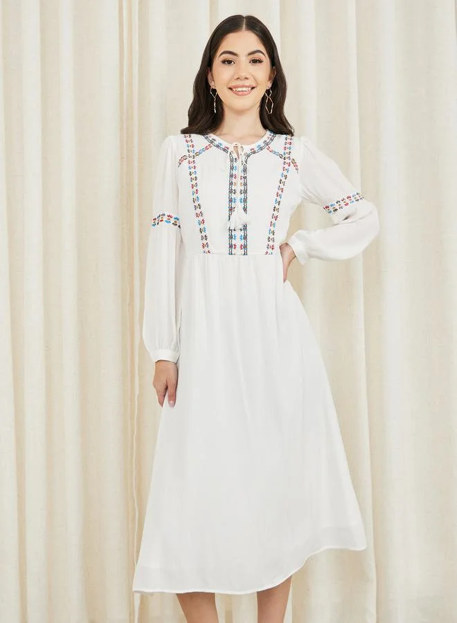 Styli Embroidered Tie Up Neck A-Line Midi Dress
