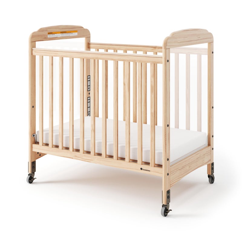 Foundations Serenity Compact Clearview Daycare Crib Fixed Side Durable Wood Construction Adjustable Mattress Board Clear End Panels Includes 3 InfaPure Foam Mattress Natural