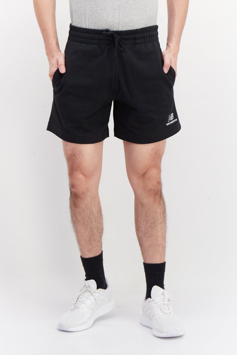 New Balance سروال رياضي للرجال مزين بتطريز مع أربطة سحب، أسود - Image 1