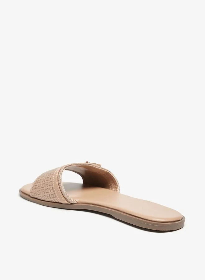 فلورا بيلا من شو إكسبرس Womens Monogram Print Slip-On Flat Sandals