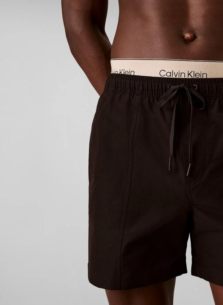 CALVIN KLEIN  Double Logo Waistband Swim Shorts for Men | Best Price UAE