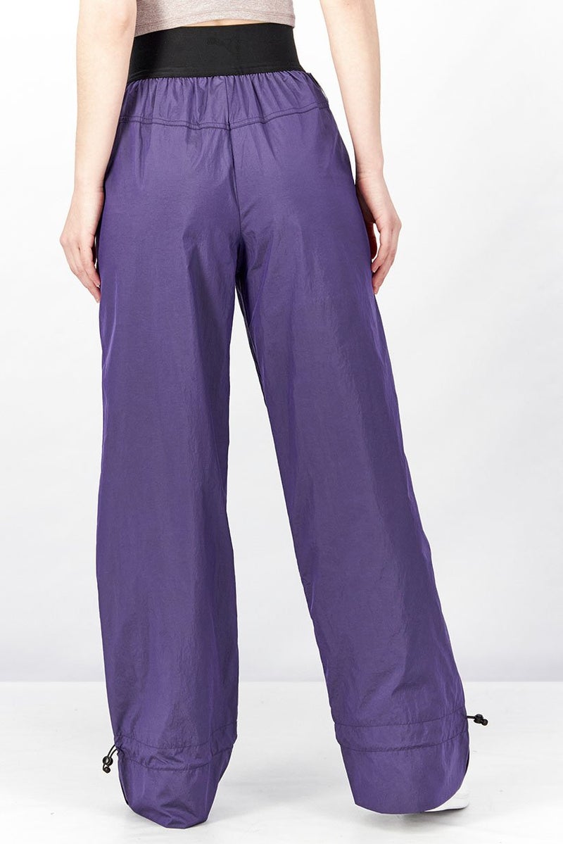 PUMA Women Sportswear Fit Pronounce High Waist Woven Pants, Purple and Black  - Image 4
