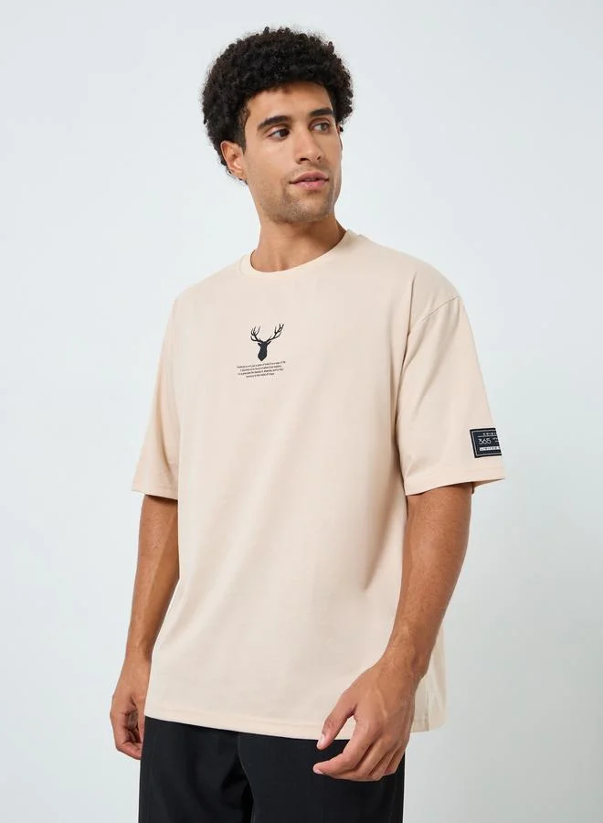 Styli Men Beige Graphic Oversized T-Shirt