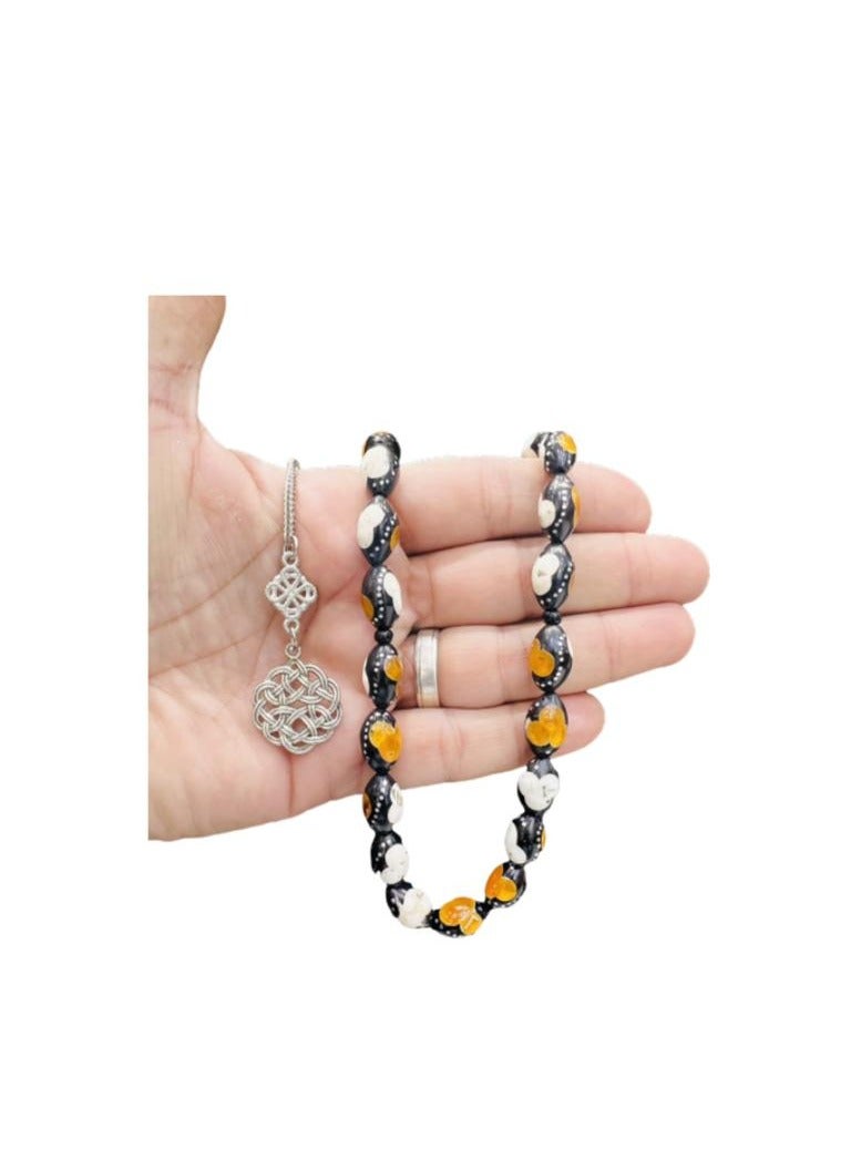 A wonderful rosary made of cocoa wood with a mixture of stone and metal on it, with a distinctive Trabzon metal tassel. We present it in a box to make it easy to present as gifts to loved ones. It is suitable for all occasions, Hajj, Umrah, Ramadan and holidays. Bead size 8 mm Number of beads 33 beads - Image 1