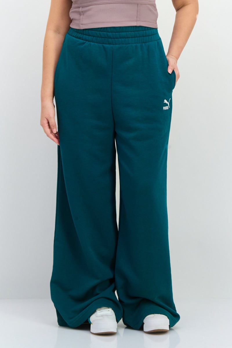 PUMA Women Relaxed Fit Drawstring Outdoor Sweatpants, Green - Image 1