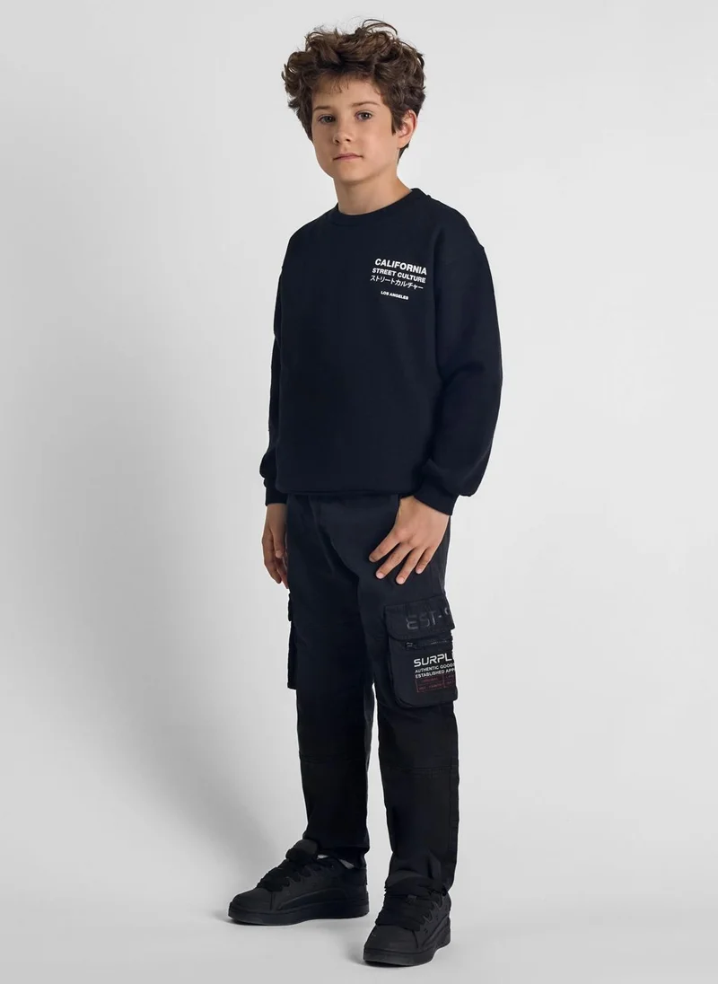 MINOTI Teen Boys Cargo Trousers with Zipped Pockets and a Print