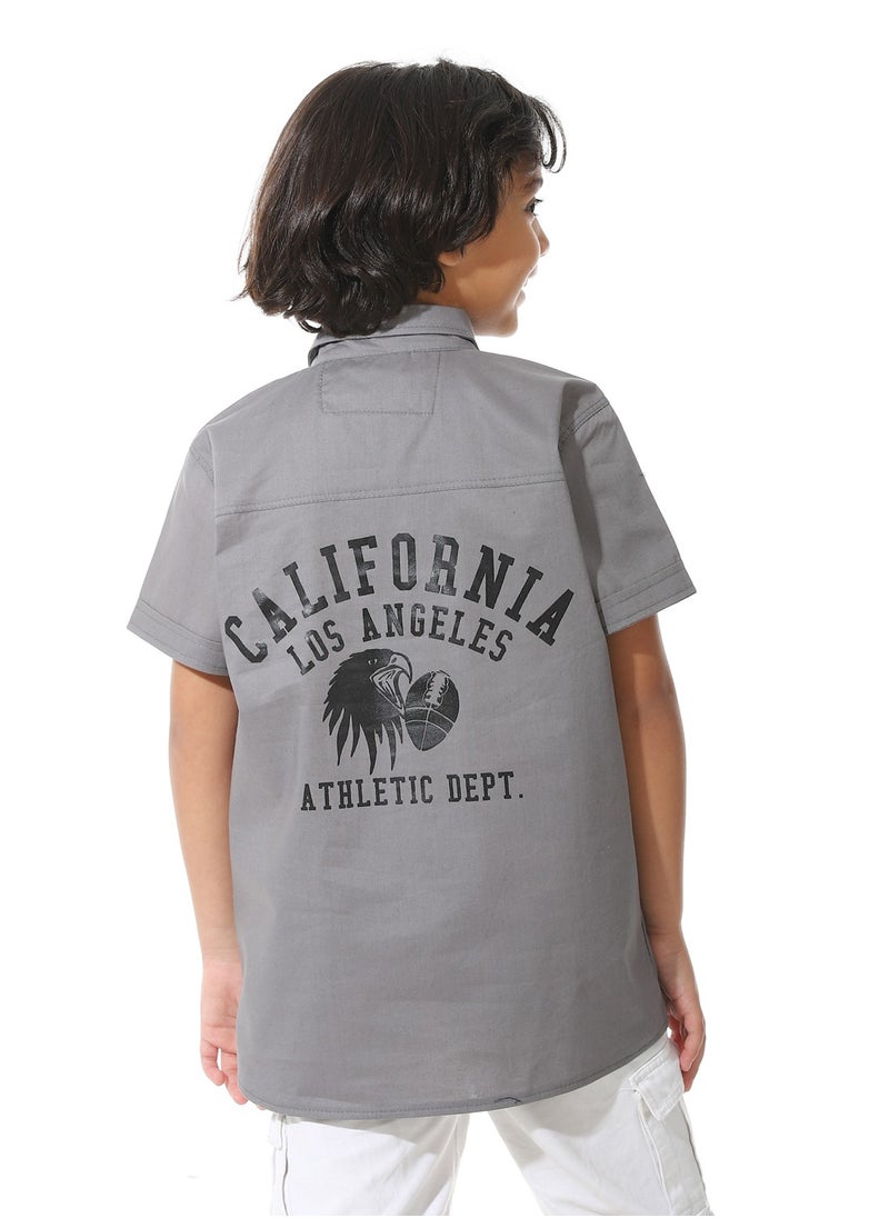 Boys' shirt with front pockets and back print