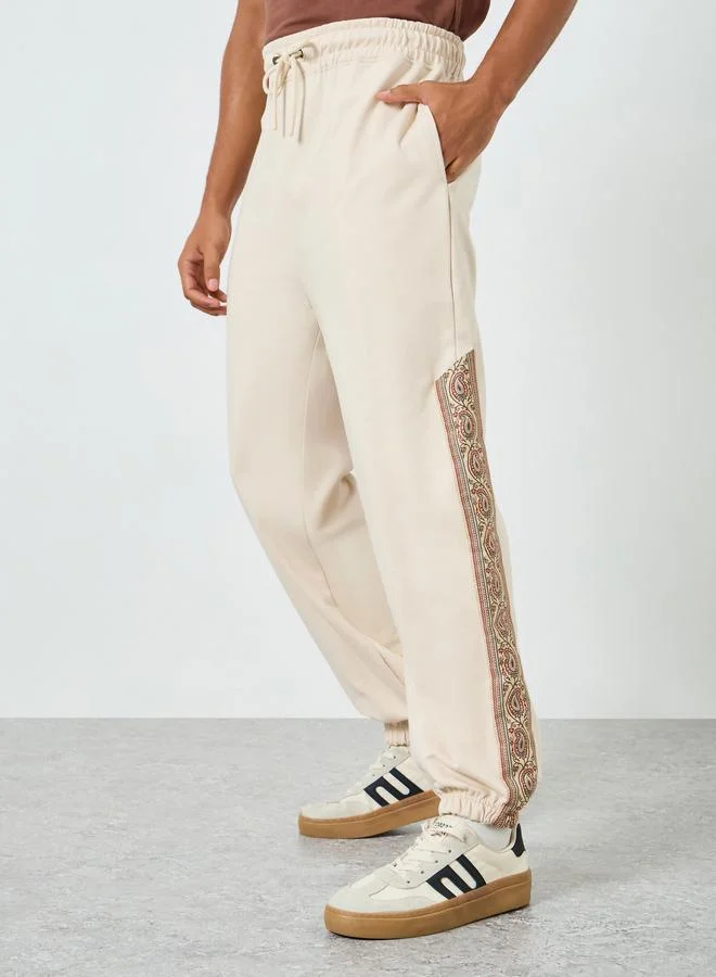 Men Beige Printed Side Panel Joggers