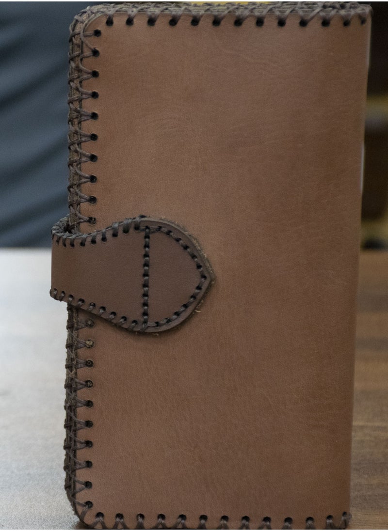 Handmade Genuine Leather Wallet – Premium Quality & Elegant Design!  100% genuine leather Unique laser engraving detail Magnetic clasp for secure closure Internal zipper with multiple compartments Luxurious lining and photo mesh Size: 9×20 cm – practical and stylish Plenty of card slots and large pockets for organized storage Available now at the best price on  Noon with fast and safe delivery!